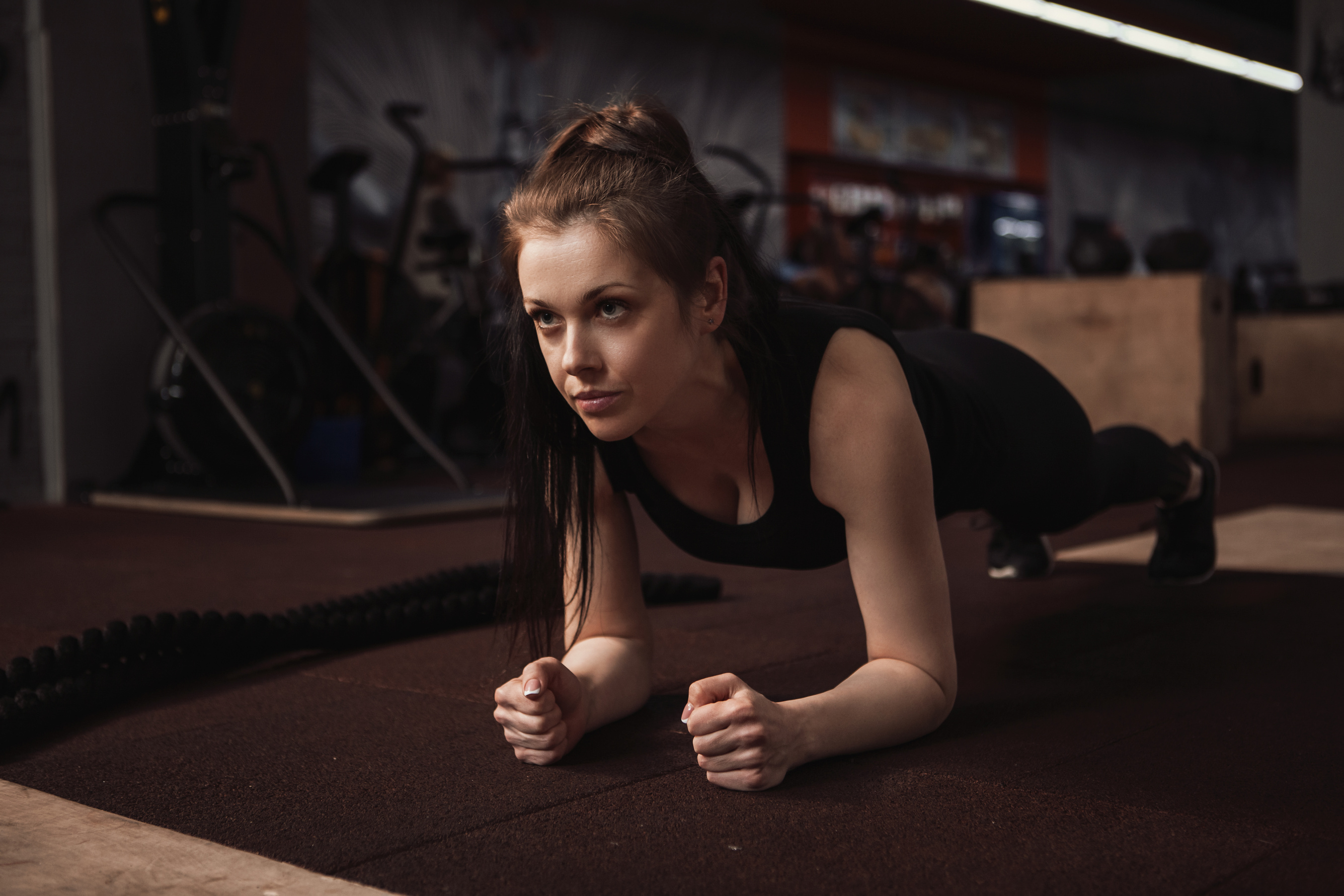 Sportswoman exercising at functional training gym